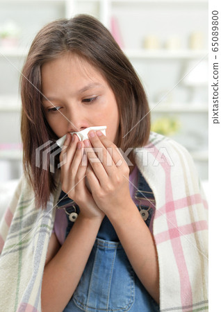 Close up portrait of sick little girl 65089800