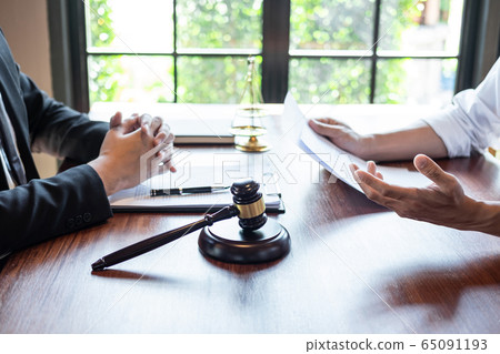 Male lawyer discussing negotiation legal case with 65091193