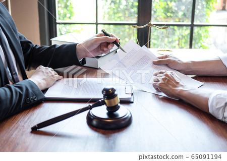 Professional male lawyer or counselor discussing Professional male lawyer or counselor discussing 65091194