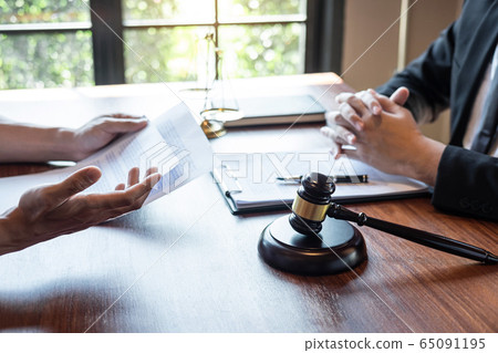 Professional male lawyer or counselor discussing Professional male lawyer or counselor discussing 65091195