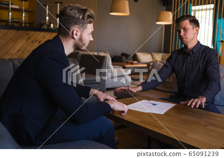 Businessmen congratulated themselves on their foresight in keeping out of it in cafe Businessmen congratulated themselves on their foresight in keeping out of it in cafe 65091239
