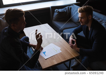 Businessmen congratulated themselves on their foresight in keeping out of it in cafe Businessmen congratulated themselves on their foresight in keeping out of it in cafe 65091240