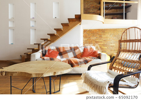 Modern cozy loft. Chair, table and sofa Modern cozy loft. Chair, table and sofa 65092170