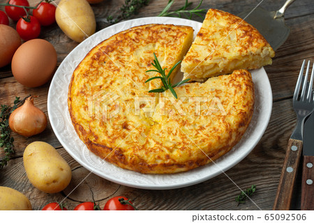 Spanish tortilla with potatoes and onion. Spanish tortilla with potatoes and onion. 65092506