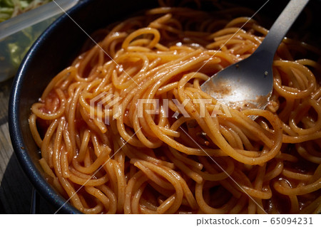 Pasta, soup and salad to eat outdoors on a wooden table 65094231