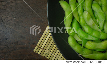 The Edamame in black plate top view image for food content. The Edamame in black plate top view image for food content. 65094846