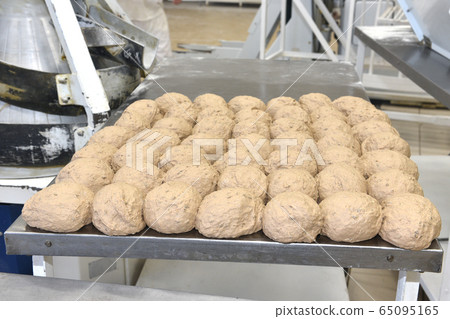 Raw bread ready for putting into the oven Raw bread ready for putting into the oven 65095165