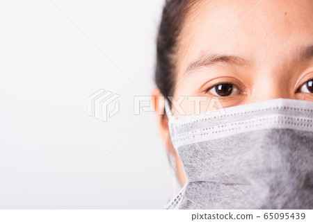 closeup woman wearing face mask protective against 65095439
