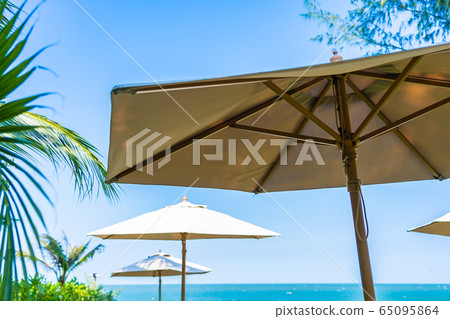 Umbrella and chair around beach sea ocean Umbrella and chair around beach sea ocean 65095864