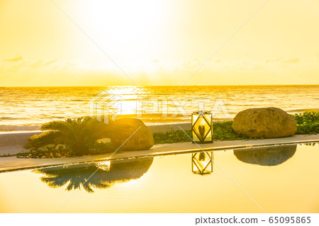 Beautiful luxury outdoor swimming pool in hotel resort for holiday vacation Beautiful luxury outdoor swimming pool in hotel resort for holiday vacation 65095865