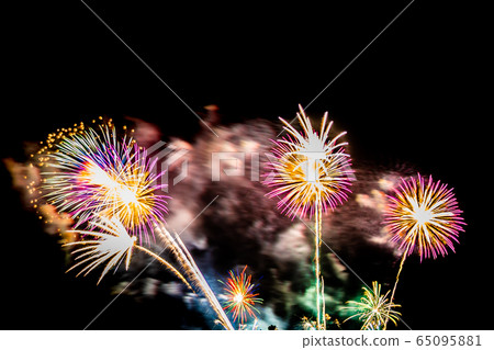 Beautiful colorful firework display at night for celebrate Beautiful colorful firework display at night for celebrate 65095881