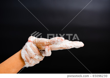 woman washing hands with soap have foam 65096230