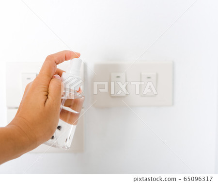 woman applying press dispenser sanitizer alcohol woman applying press dispenser sanitizer alcohol 65096317