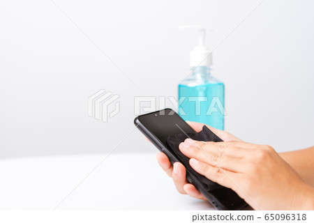 woman applying press dispenser sanitizer alcohol woman applying press dispenser sanitizer alcohol 65096318
