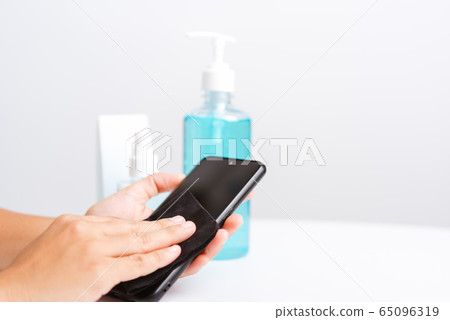 woman applying press dispenser sanitizer alcohol woman applying press dispenser sanitizer alcohol 65096319