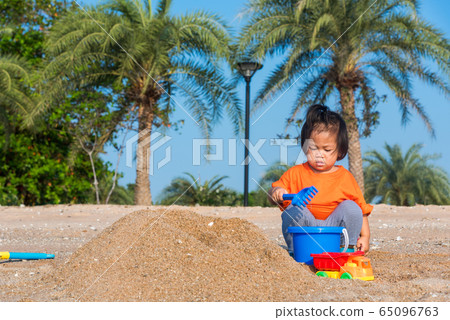 Brother and sister two children funny digging play 65096763