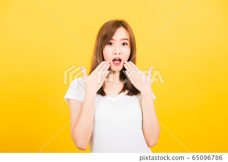 woman teen standing amazed, shocked afraid wide woman teen standing amazed, shocked afraid wide 65096786