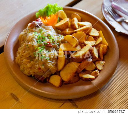 Polish stew of pork ribs and sauerkraut Polish stew of pork ribs and sauerkraut 65096787