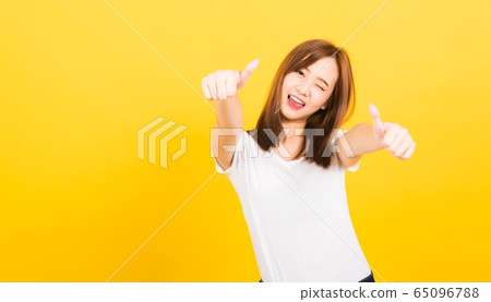 woman teen standing wear t-shirt showing gesturing woman teen standing wear t-shirt showing gesturing 65096788