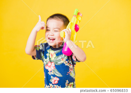 little children boy so happy in Songkran festival little children boy so happy in Songkran festival 65096833