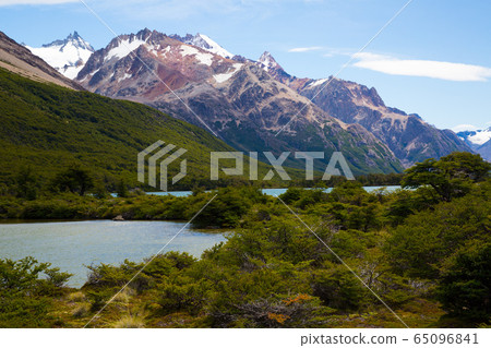 River in valley at foot of Andes mountains River in valley at foot of Andes mountains 65096841