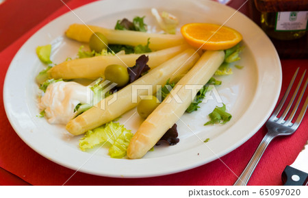 Baked white asparagus with greens Baked white asparagus with greens 65097020