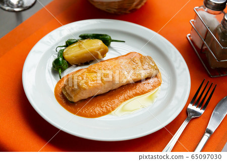 Roasted salmon with bell peppers and potato Roasted salmon with bell peppers and potato 65097030