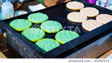 Arepas from corn meal, Venezuelan traditional fast street food Arepas from corn meal, Venezuelan traditional fast street food 65097033
