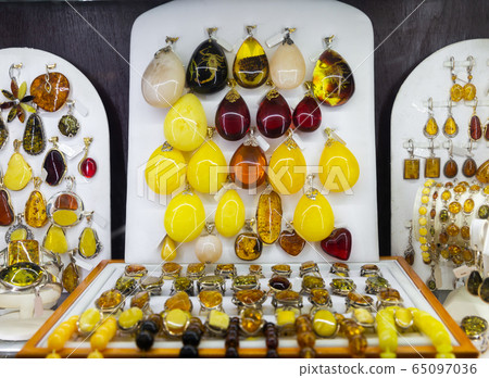 Amber jewelry in store window Amber jewelry in store window 65097036