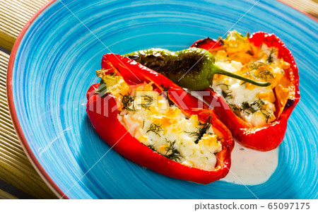Pepper stuffed with brynza is tasty dish of Bulgarian cuisine Pepper stuffed with brynza is tasty dish of Bulgarian cuisine 65097175