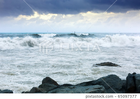sea wave during storm in cloudy day sea wave during storm in cloudy day 65097377