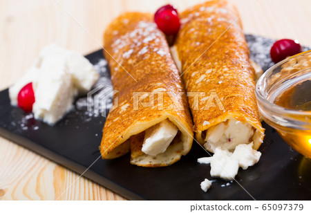 Bulgarian thin pancakes with brynza Bulgarian thin pancakes with brynza 65097379