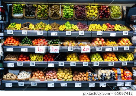 Raw fresh vegetables and fruits assortment on counter 65097412