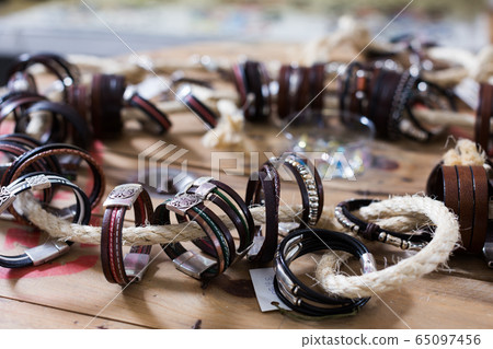 The store selling different leather bracelets 65097456