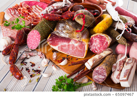 Variety of meats on table Variety of meats on table 65097467