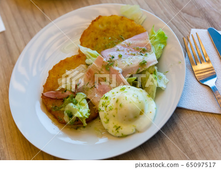 Potato pancakes with bacon and egg Potato pancakes with bacon and egg 65097517