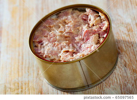 Tin can with ham on a wooden surface Tin can with ham on a wooden surface 65097565