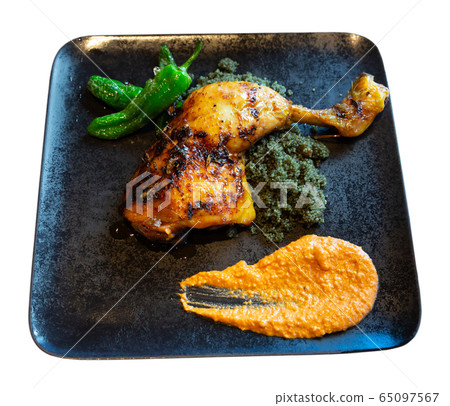 Chicken drumstick with couscous with black curry, peppers and Romesco Chicken drumstick with couscous with black curry, peppers and Romesco 65097567