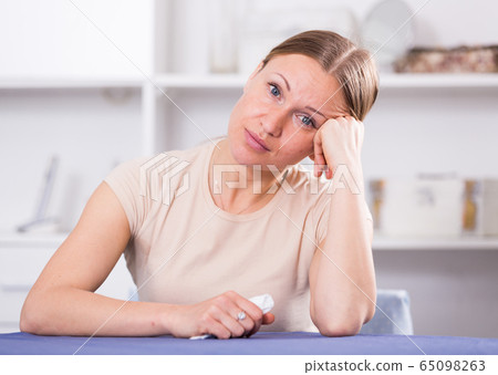 Woman concentrating on work on laptop 65098263