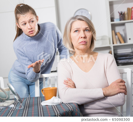 Adult daughter scolds mature mother 65098300