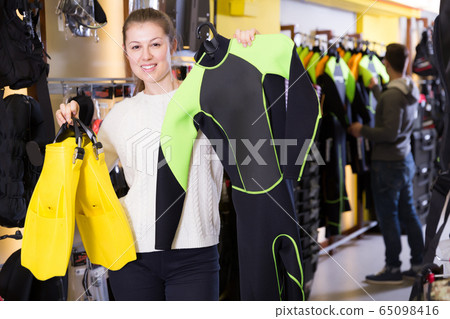 Glad woman is satisfied of costumes for diving Glad woman is satisfied of costumes for diving 65098416