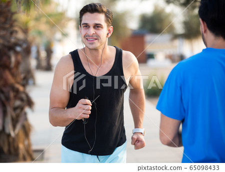 Two friends are doing race in time training Two friends are doing race in time training 65098433