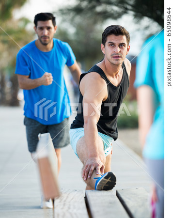 Two friends are doing warm-up Two friends are doing warm-up 65098644