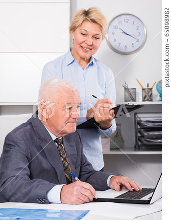 Manager and secretary working 65098982