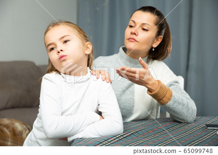 Unhappy young woman discuss conflict with small daughter Unhappy young woman discuss conflict with small daughter 65099748