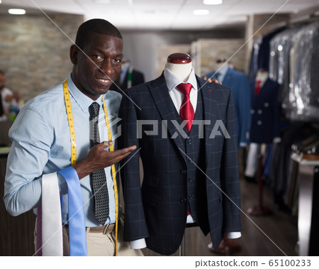 Portrait of afro-american man customer choosing business style tie in the shop Portrait of afro-american man customer choosing business style tie in the shop 65100233