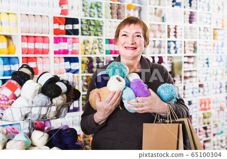 Client is standing with shopping bags Client is standing with shopping bags 65100304