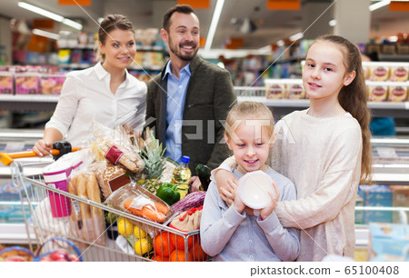 Family with purchases in supermarket Family with purchases in supermarket 65100408
