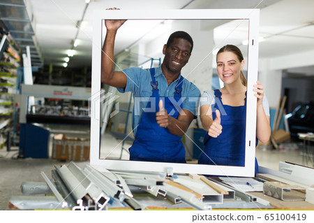 Adult masters are holding modern window frames Adult masters are holding modern window frames 65100419