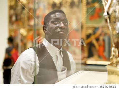 Man standing at hall of Art Museum Man standing at hall of Art Museum 65101633